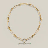 A product photograph showing how the twisted link gold women's chain can be styled with a diamond connect and vintage inspired t bar pendant.